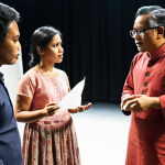 **Behind-the-scenes of a theatrical production:** Puan Sri Aishah Rahman, a seasoned theatre director, giving direction to a diverse cast during a rehearsal. Focus on the collaborative environment, emphasizing effective communication and mutual respect between the director and actors. Include elements of Malaysian culture in the set design or costumes. Lighting is warm and inviting.